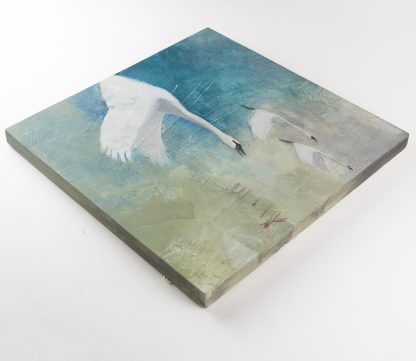 Three swans in flight, mixed media on panel.